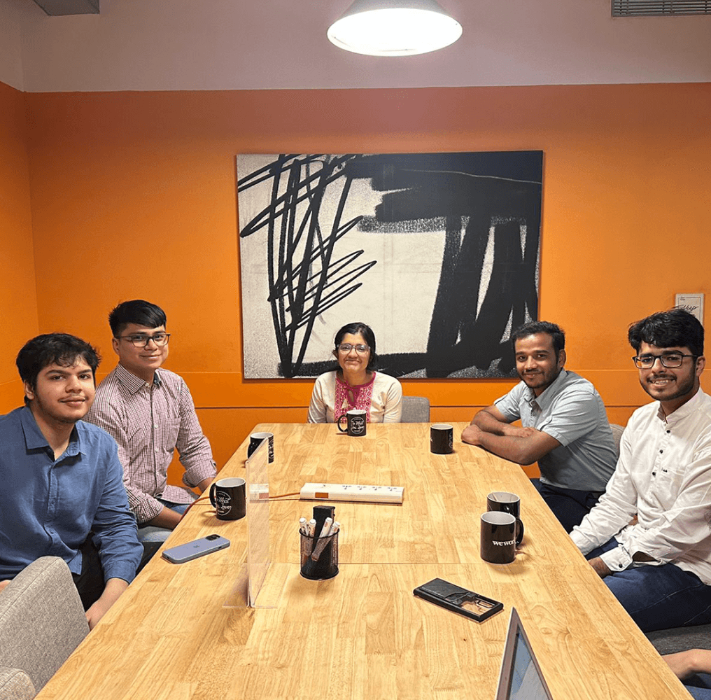 FarMart summer interns at conference table